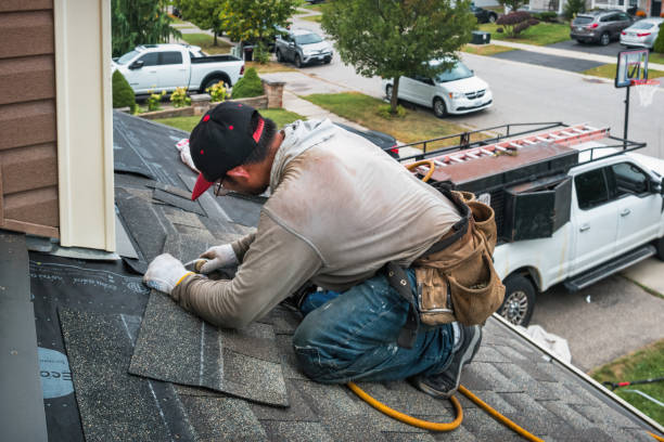 Professional Roof Replacement technician working in State Center, IA